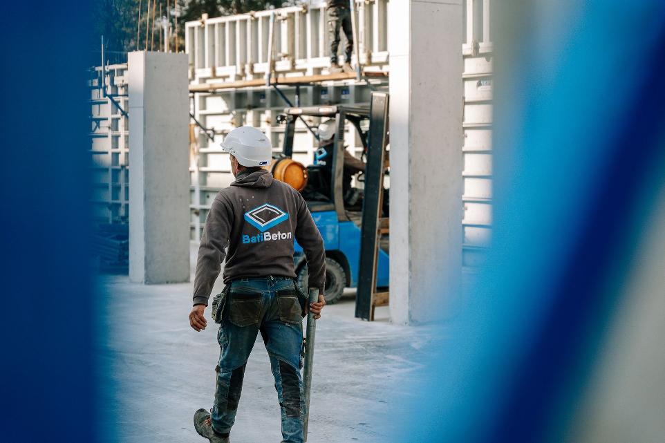 Worker walks around in the concrete foundations